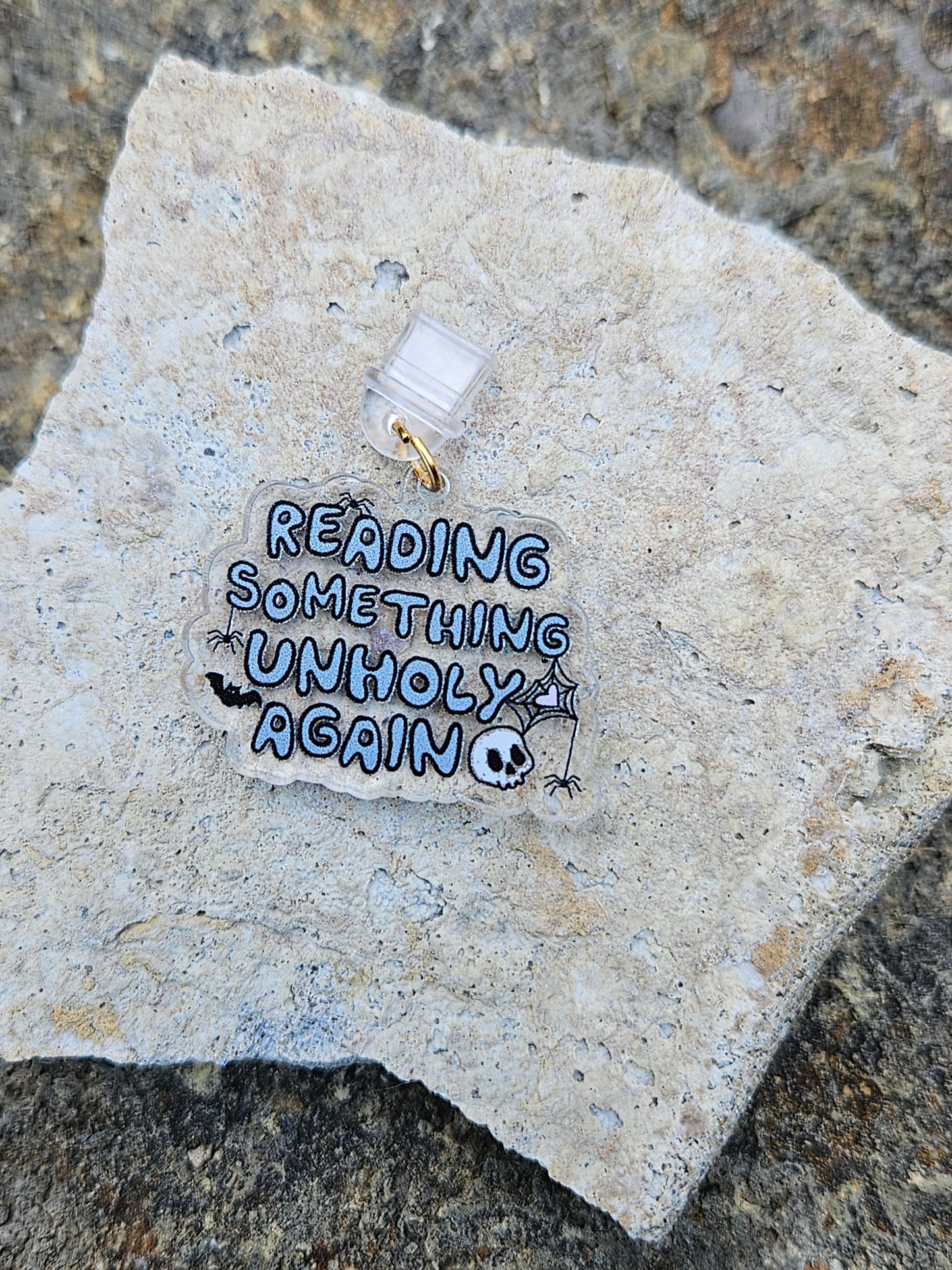 READING SOMETHING UNHOLY KINDLE CHARM